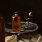 Still Life with Salami, Bread, Biscuits and Glass Bottles